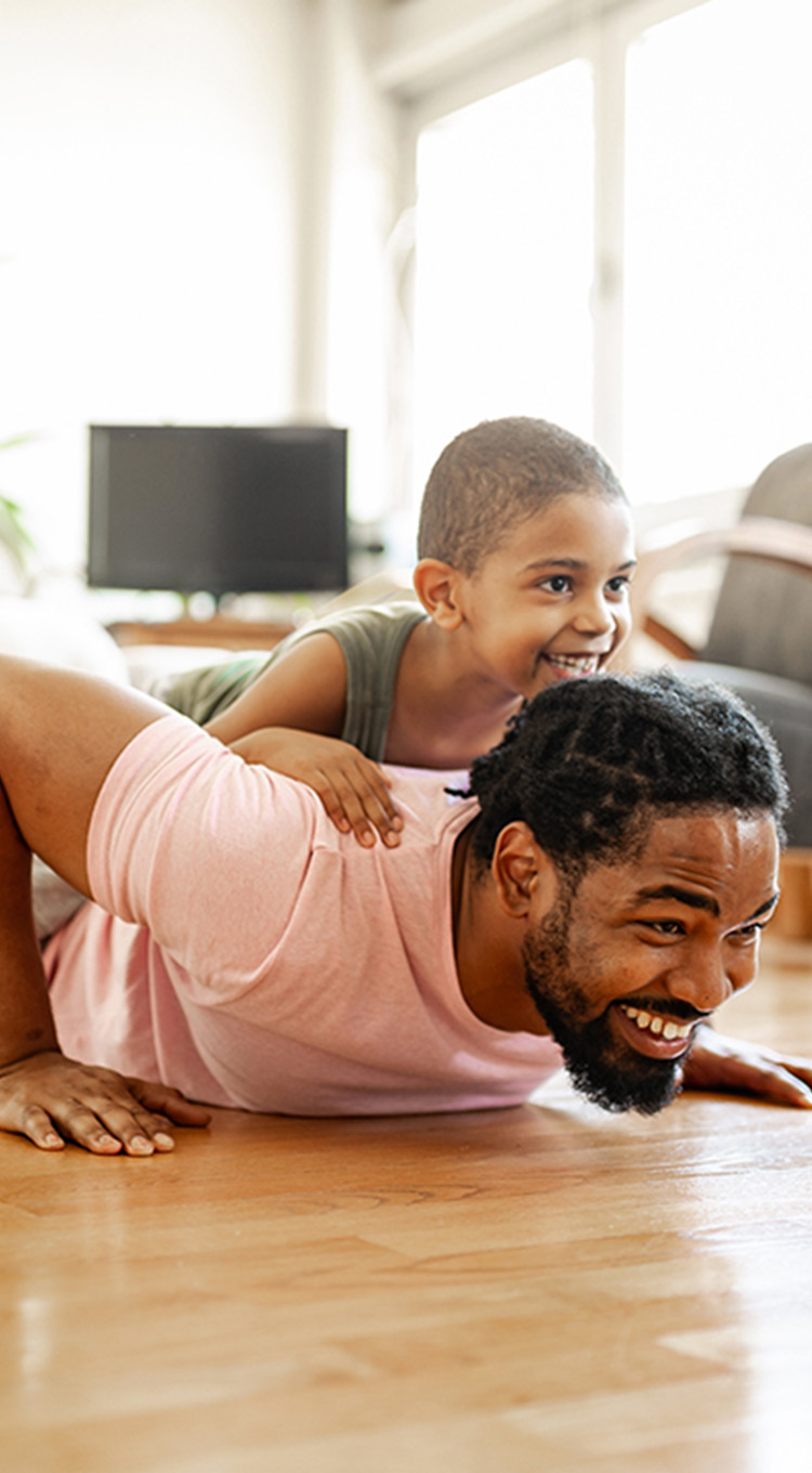 Dad playing on woodlook floors 