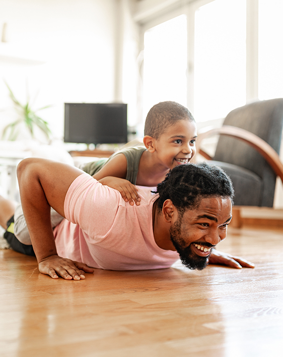 Dad playing on woodlook floors 